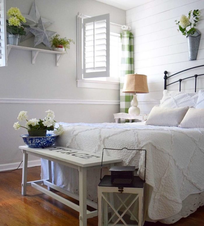 Photo Credit: Finishing Touch Decor By Jenny Open plantation shutters in a bedroom